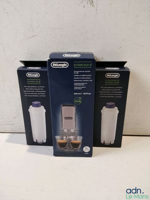 three boxes of coffee machines sitting on a counter top