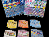 a lot of pokemon cards that are on the table