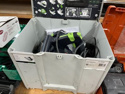 a box with tools in it sitting on the floor