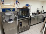 a commercial kitchen with stainless steel appliances and counter tops