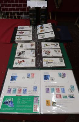 a lot of stamps on a table with a red table cloth