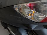 a close up of a motorcycle headlight on a motorcycle