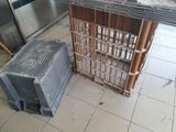 two crates sitting on the floor next to each other