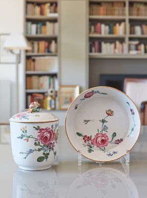 two bowls and a bowl on a table in a living room