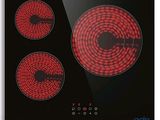 une image représentant une plaque de cuisson noire et rouge à trois feux