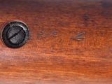 an image of a close up of a piece of wood with a clock on it