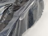 a plastic bag that has a motorcycle cover on it