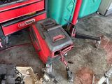a garage with tools and tools on the floor