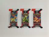 trois paquets de cartes à collectionner Pokémon