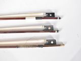 four different types of violin bows on a white surface