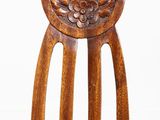 a close up of a wooden chair with a cushion on it