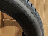 a close up of a tire on a cardboard box in a room