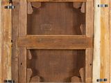 an old wooden cabinet with a shelf on top of it