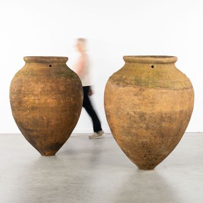two large vases that are sitting on the floor