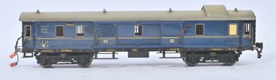 a blue train car that is sitting on the tracks