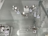 a glass display case with a lot of jewelry on it