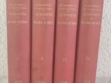 four red books are lined up on a white surface