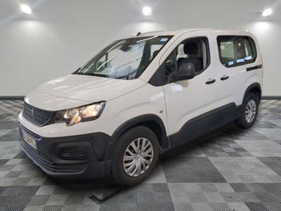 the white van is parked on a checkered floor in a room