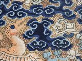an image of a close up of a piece of cloth with a bird on it