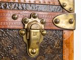a close up of a trunk with a lock on it
