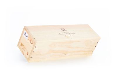 a wooden box with a label on it on a white background