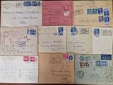 several old envelopes are sitting on top of a wooden table