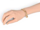 gold chain bracelet on a mannequin hand on a white background