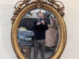 a man taking a picture of himself in a mirror
