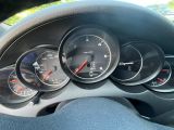 a close up of a car dashboard with gauges