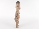 an image of a wooden statue of a man with his hands on his hips