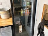 a refrigerator that is sitting in a kitchen next to a counter