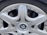 a close up of a car ' s tire on the street