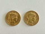 two gold sovereigns, one of which is a sovereign and the other of which is a sovereign