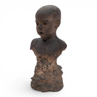 an old wooden bust of a child on a white background