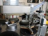 an image of a machine that is making doughnuts