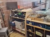 an image of a kitchen with a lot of clutter on the floor