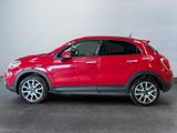 the red fiat suv is parked in a large room