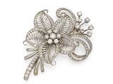 a diamond and pearl flower broochle