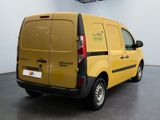a yellow van that is parked in a room