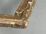 a close up of a wooden frame with peeling paint
