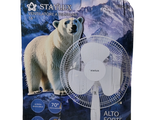 a picture of a polar bear standing next to a fan