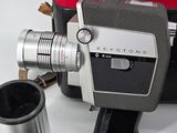 a camera and some other items that are on a table