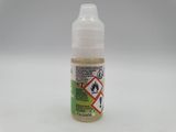 a close up of a bottle of liquid on a white surface