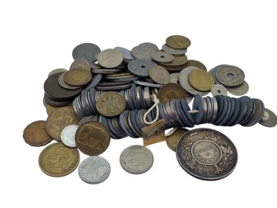 a pile of coins and a coin purse on a white background