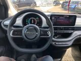 the interior of a car with a steering wheel and a dash board