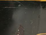 a close up of a black suitcase with a yellow stripe on it