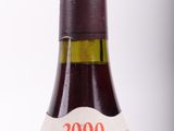 a bottle of wine that is sitting on a table