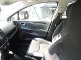 the interior of a small car with a steering wheel and a dashboard