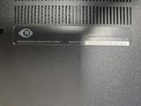 a close up of a laptop with a metal cover