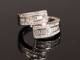 an image of a pair of diamond rings on a black surface